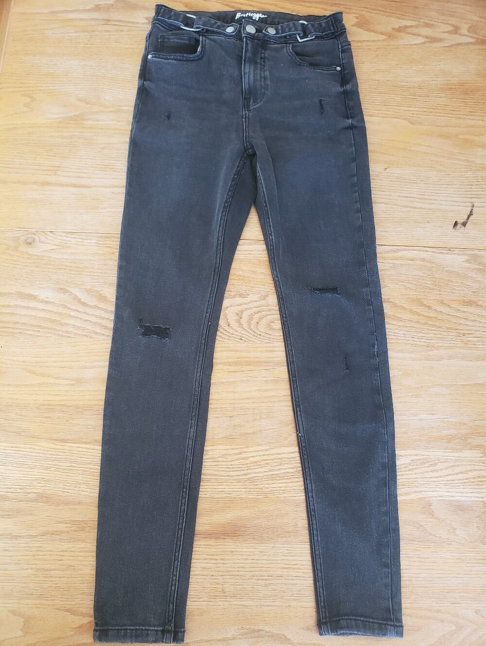 Ultra High-Rise Black Skinny Jeans with Subtle Knee Detail Bootlegger